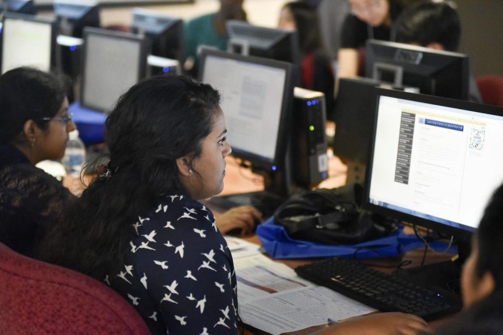 Student looking at desktop computer screen