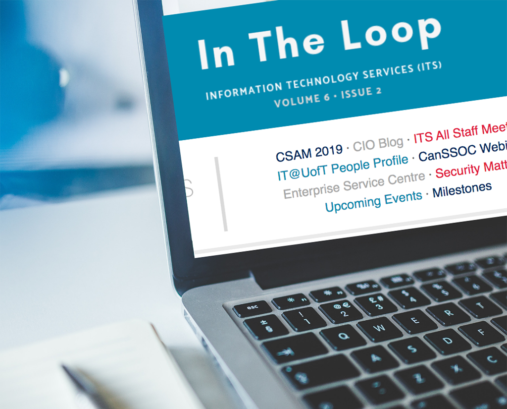 Laptop screen with In The Loop newsletter on it