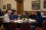 ITS staff talking around a table during all managers meeting in March 2020