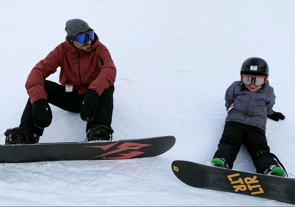 Marco Di Vittorio with his daughter snowboarding