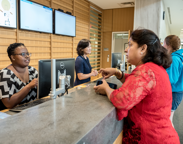 Person at help desk counter