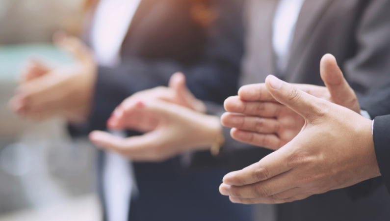 Hands clapping during a celebration