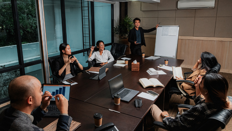 People engaging in a group meeting.