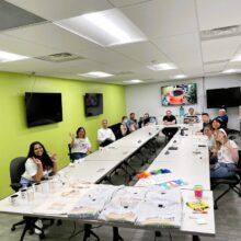 Group shot of the in-office Pride coffee break celebration event.