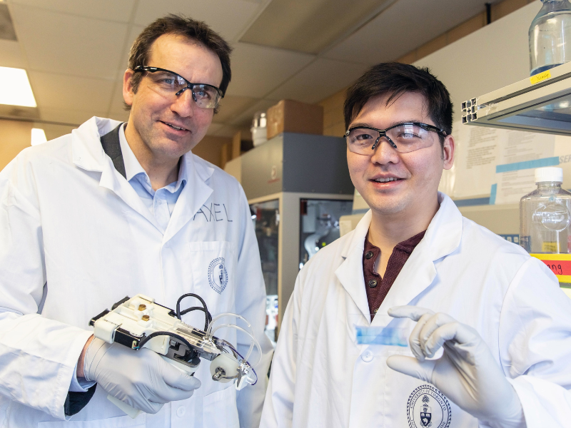 Researchers performing experiment in a lab in U of T.