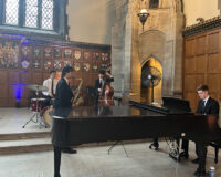 Entertainment at the evening social in the Great Hall, Hart House.