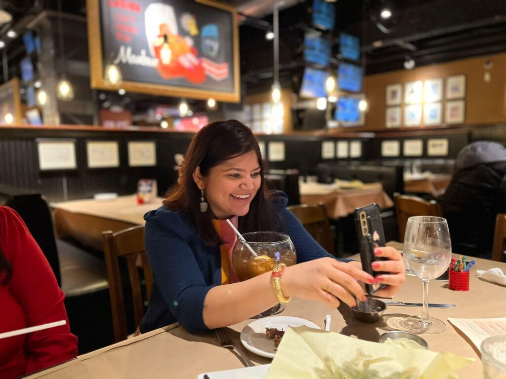 Kanupriya taking a photo at one of her events