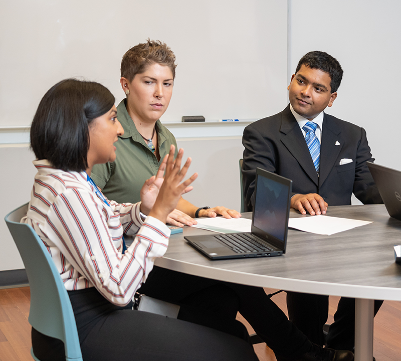 Staff having a discussion in a meeting room