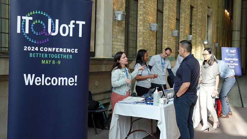 Volunteers greeting attendees at the IT@UofT 2024 conference.