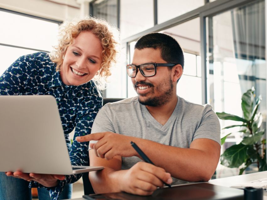 People collaborating using a laptop computer