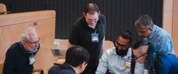 Staff members solving problems together